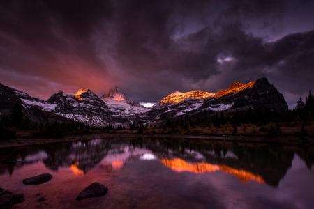 Assiniboine Mountain, is a mountain located on the Great Divide, on the British Columbia/Alberta border in Canada. At 3,618 m (11,870 ft), it is the highest peak in the Southern Continental Ranges of the Canadian Rockies. Mt. Assiniboine rises nearly 1,525 m (5,003 ft) above Lake Magog. Because of its resemblance to the Matterhorn in the Alps, it is nicknamed the "Matterhorn of the Rockies".