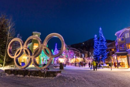 Christmas fairy lights with the Winter Olympic Games rings in the foreground in Whistler Village.